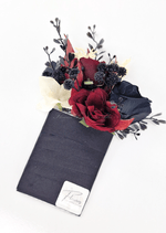 Artificial wedding pocket corsage with burgundy and black faux roses, black berries, cream blooms and dark sprigs on a black backing. For formals, proms and ball occasions. Made in Melbourne by Flowers For Ever After, shipping Australia and Worldwide.