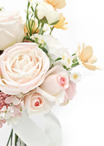Artificial wedding bouquet close-up with blush faux roses, white daisies, yellow blooms and trailing ivory ribbon. Made in Melbourne by Flowers For Ever After, shipping Australia and Worldwide.