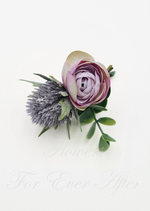 Artificial wedding boutonniere close-up with a white faux rose, small white flowers and green foliage. For formals, proms and ball occasions. Made in Melbourne by Flowers For Ever After, shipping Australia and Worldwide.