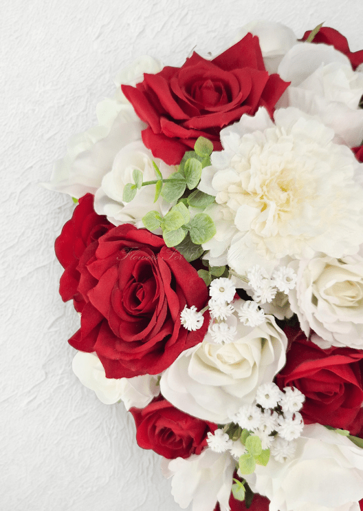 Artificial wedding bouquet close-up with red and white faux roses, white dahlia, tiny white flowers and pale eucalyptus. Made in Melbourne by Flowers For Ever After, shipping Australia and Worldwide.
