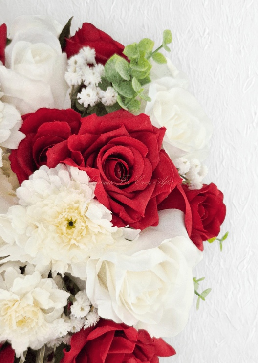 Artificial wedding bouquet detail showing red and white faux roses, white dahlias and tiny white flowers. Made in Melbourne by Flowers For Ever After, shipping Australia and Worldwide.