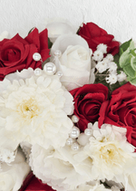 Artificial wedding bouquet close-up with red and white faux roses, white dahlias and pearl-style accents. Made in Melbourne by Flowers For Ever After, shipping Australia and Worldwide.