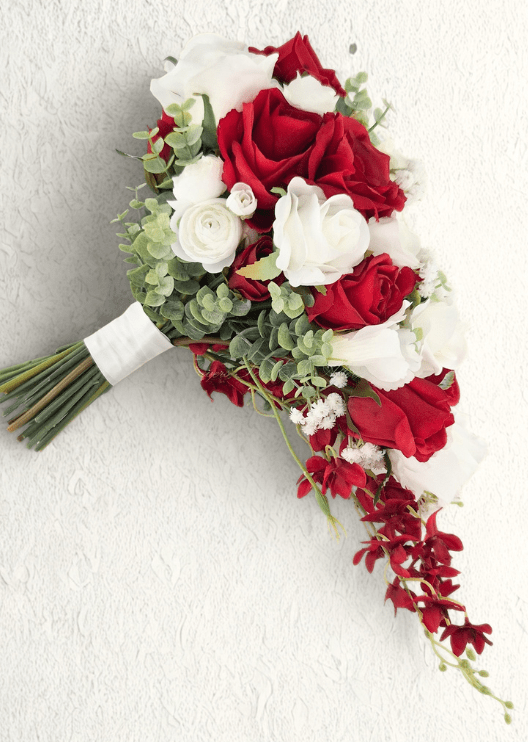 Artificial wedding cascading bouquet, side view of red and white faux roses, trailing red orchids and white-wrapped stems. Made in Melbourne by Flowers For Ever After, shipping Australia and Worldwide.
