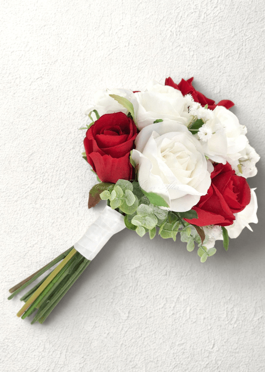 Artificial wedding small bouquet, side view of red and white faux roses, tiny white flowers, pale eucalyptus and white-wrapped stems. Made in Melbourne by Flowers For Ever After, shipping Australia and Worldwide.