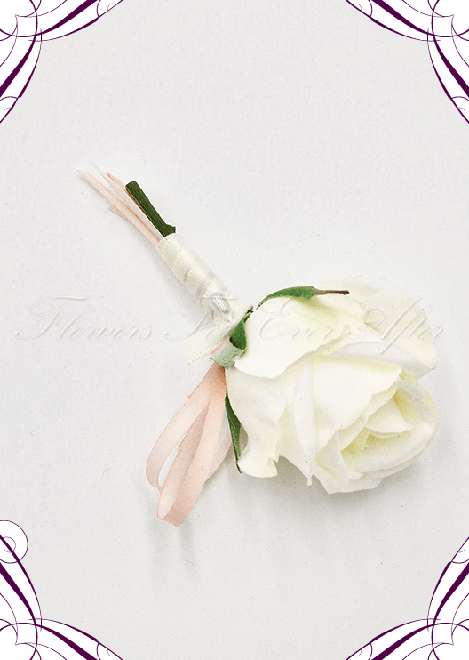 Artificial wedding boutonniere close-up showing a white faux orchid, pale flowers and green leaves. For formals, proms and ball occasions. Made in Melbourne by Flowers For Ever After, shipping Australia and Worldwide.