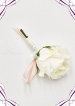 Artificial wedding boutonniere close-up showing a white faux orchid, pale flowers and green leaves. For formals, proms and ball occasions. Made in Melbourne by Flowers For Ever After, shipping Australia and Worldwide.