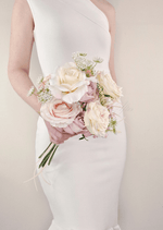 Artificial wedding bridesmaid bouquet, side view of white faux orchids, small blooms and wrapped stems. Made in Melbourne by Flowers For Ever After, shipping Australia and Worldwide.