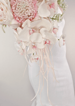 Artificial wedding cascading bridal bouquet with white faux orchids and green leaves, finished with wrapped stems. Made in Melbourne by Flowers For Ever After, shipping Australia and Worldwide.