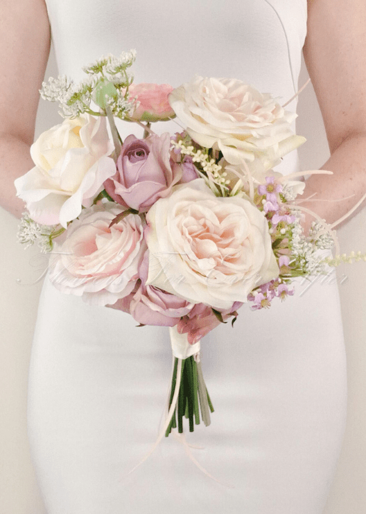 Artificial wedding bridesmaid bouquet with white faux orchids, small flowers and green foliage. Made in Melbourne by Flowers For Ever After, shipping Australia and Worldwide.