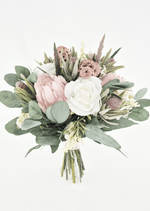 Artificial wedding bridal bouquet with ivory faux roses, blush pink proteas, tan lotus pods, grey seedpods and broad eucalyptus foliage. Made in Melbourne by Flowers For Ever After, shipping Australia and Worldwide.