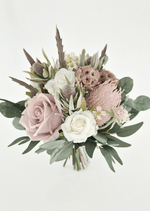 Artificial wedding bridesmaid bouquet with blush and ivory faux roses, pink spiky bloom, tan lotus pods, grey seedpods and eucalyptus. Made in Melbourne by Flowers For Ever After, shipping Australia and Worldwide.