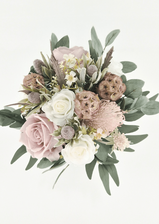 Artificial wedding bouquet, overhead view of blush and ivory faux roses, pink spiky blooms, tan lotus pods, grey seedpods and eucalyptus. Made in Melbourne by Flowers For Ever After, shipping Australia and Worldwide.