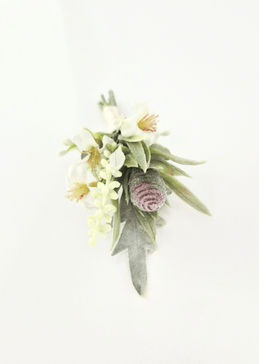 Artificial wedding boutonniere, overhead view of cream faux flowers, grey seedpod, pale budding sprigs and muted green leaves. For formals, proms and ball occasions. Made in Melbourne by Flowers For Ever After, shipping Australia and Worldwide.