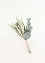 Artificial wedding boutonniere with a grey faux seedpod, pale narrow leaves, rounded eucalyptus and blush-wrapped stems. For formals, proms and ball occasions. Made in Melbourne by Flowers For Ever After, shipping Australia and Worldwide.