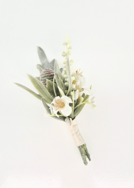 Artificial wedding boutonniere with cream faux flowers, pale budding sprigs, grey seedpod, muted green leaves and blush-wrapped stems. For formals, proms and ball occasions. Made in Melbourne by Flowers For Ever After, shipping Australia and Worldwide.