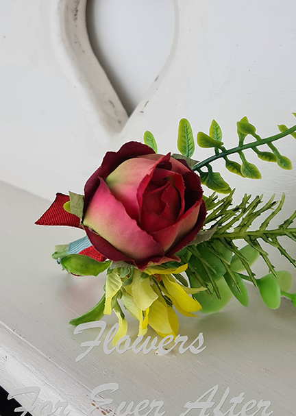 Artificial wedding boutonniere, angled view of a peach faux rose, a smaller pale rosebud and eucalyptus leaves. For formals, proms and ball occasions. Made in Melbourne by Flowers For Ever After, shipping Australia and Worldwide.