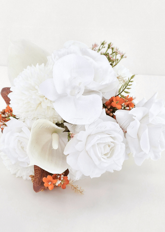 Artificial wedding bouquet, overhead view of white faux roses, orchids, hydrangea, orange sprigs and brown leaves. Made in Melbourne by Flowers For Ever After, shipping Australia and Worldwide.