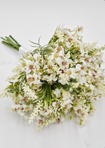 Artificial wedding bridesmaid bouquet close-up showing white faux roses, rounded blooms and delicate green sprigs. Made in Melbourne by Flowers For Ever After, shipping Australia and Worldwide.