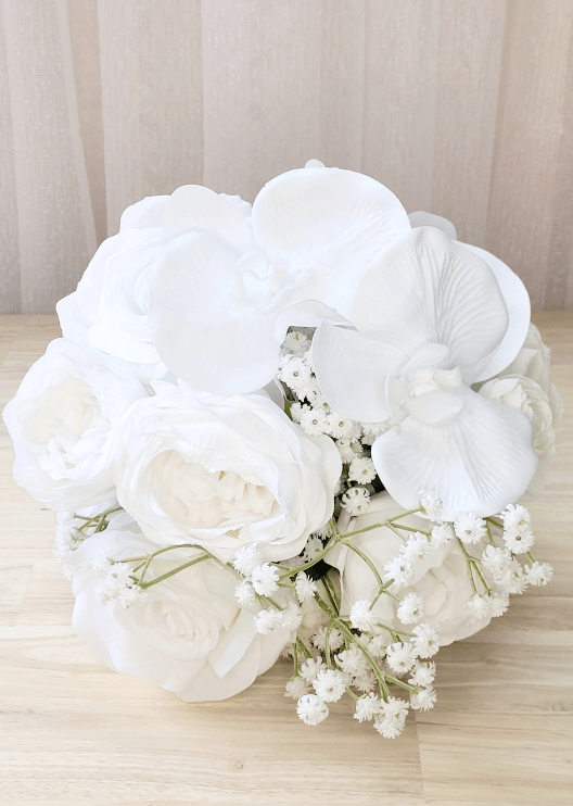 Artificial wedding bridesmaid bouquet with white faux orchids, roses and green foliage. Made in Melbourne by Flowers For Ever After, shipping Australia and Worldwide.