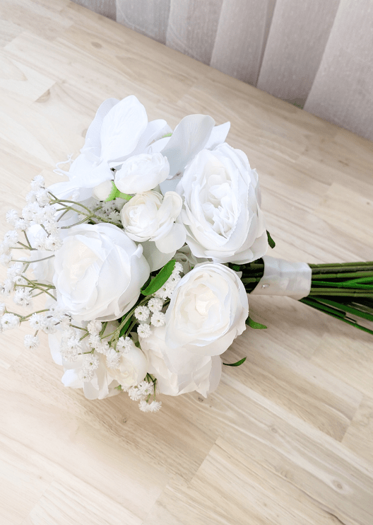 Artificial wedding bridesmaid bouquet close-up showing white faux orchid petals, roses and smaller flowers. Made in Melbourne by Flowers For Ever After, shipping Australia and Worldwide.
