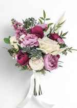 Artificial wedding bouquet with burgundy and ivory faux roses, mauve ranunculus and peonies, blue-grey berries, pink flower spikes and pale plumes. Made in Melbourne by Flowers For Ever After, shipping Australia and Worldwide.