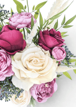 Artificial wedding bouquet detail showing an ivory faux rose, burgundy rosebuds, mauve blooms, blue-grey berries and pale plumes. Made in Melbourne by Flowers For Ever After, shipping Australia and Worldwide.