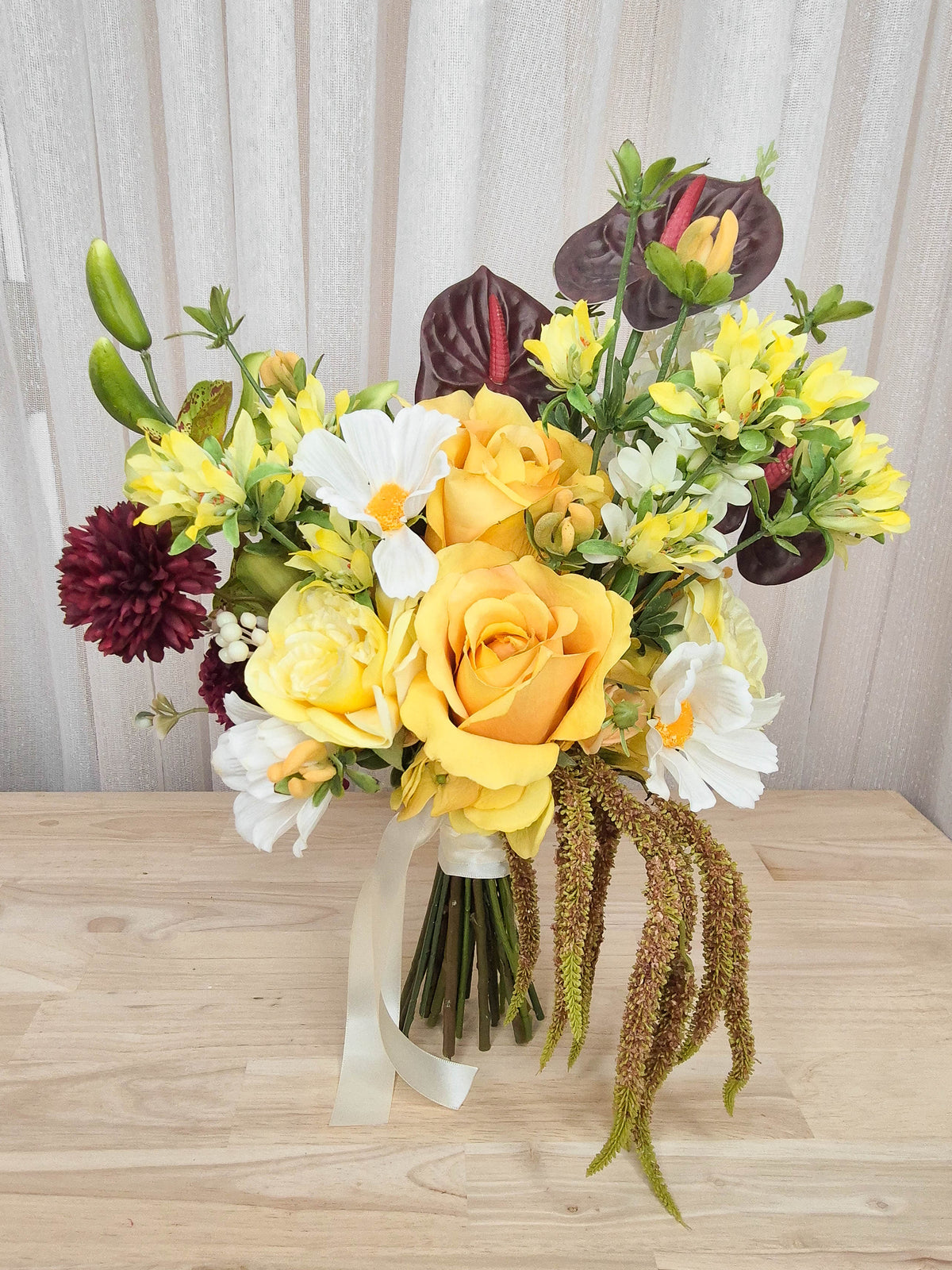A bright and boldly unique silk flower bridal bouquet. Realistic yellow, whit and burgundy faux florals in an affordable design perfect for a small wedding or elopement or registry wedding.  Made in Melbourne Australia, by Australia's best bridal florist