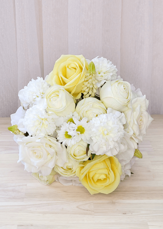 Artificial wedding bridesmaid bouquet with mixed faux roses, smaller flowers and green foliage. Made in Melbourne by Flowers For Ever After, shipping Australia and Worldwide.