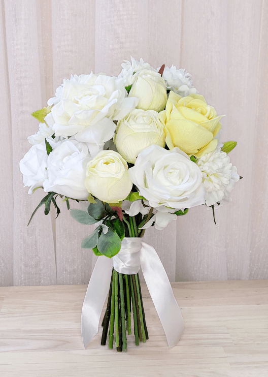 Artificial wedding bridesmaid bouquet, angled view of mixed faux roses and green leaves. Made in Melbourne by Flowers For Ever After, shipping Australia and Worldwide.