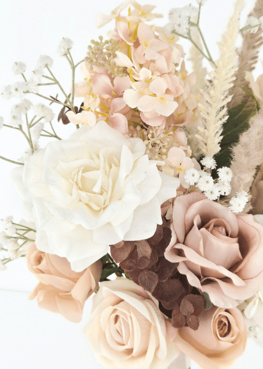 Artificial wedding bouquet close-up with ivory and taupe faux roses, peach hydrangea, pale plumes and tiny white flowers. Made in Melbourne by Flowers For Ever After, shipping Australia and Worldwide.