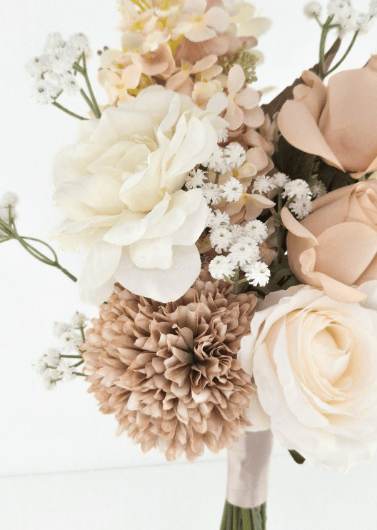 Artificial wedding bouquet close-up with an ivory faux rose, taupe chrysanthemum, peach hydrangea and tiny white flowers. Made in Melbourne by Flowers For Ever After, shipping Australia and Worldwide.