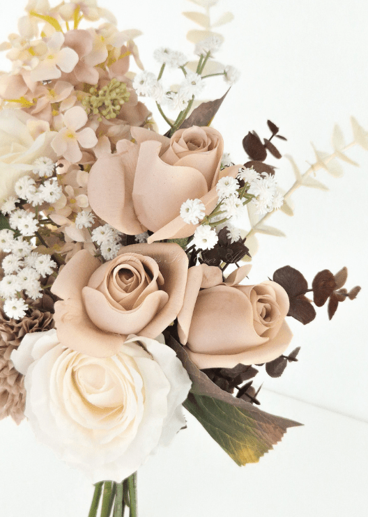 Artificial wedding bouquet detail showing tan faux rosebuds, ivory rose, peach hydrangea and tiny white flowers. Made in Melbourne by Flowers For Ever After, shipping Australia and Worldwide.