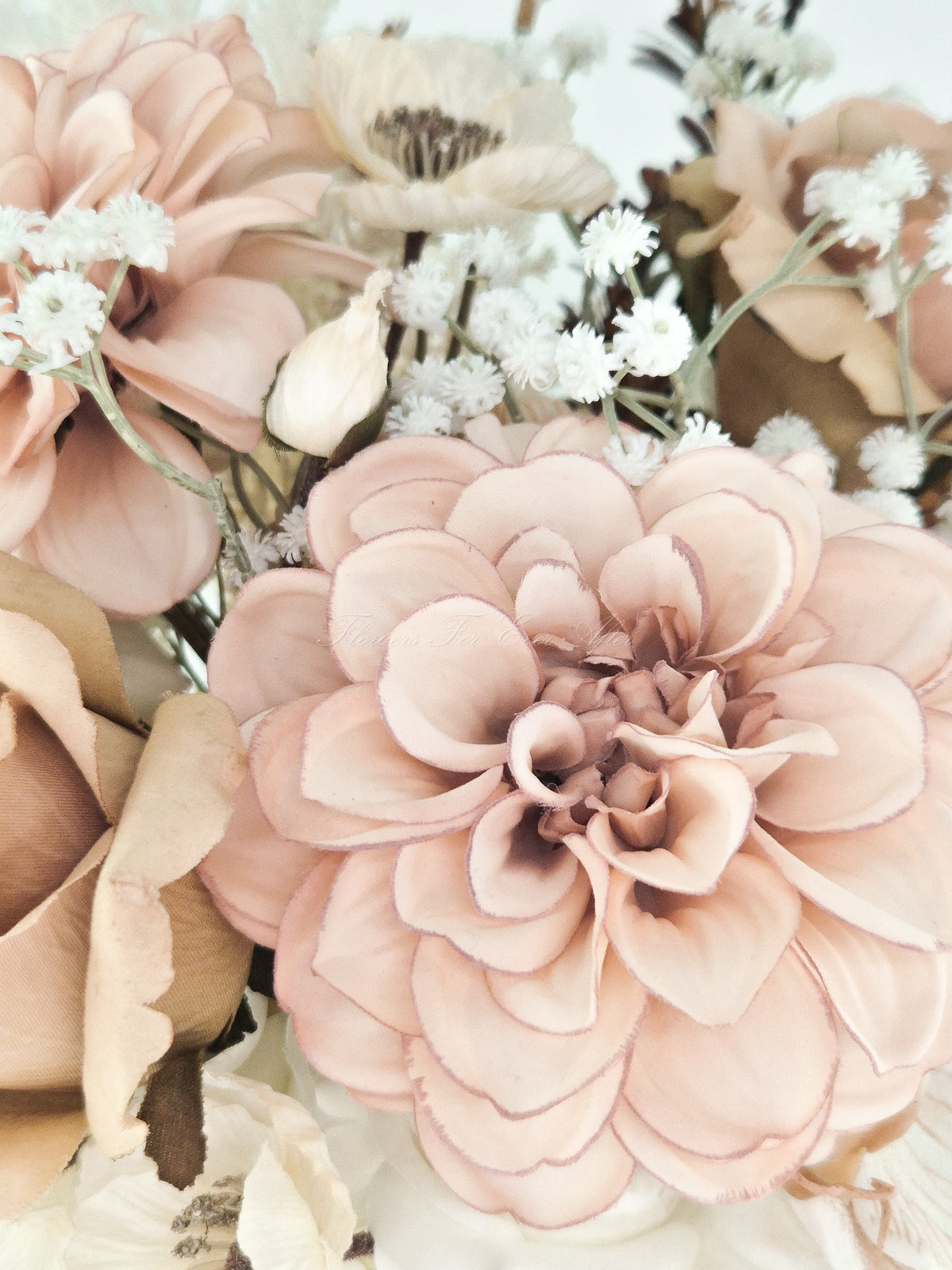 Faux bridal bouquet featuring dusty blush dahlia, cappuccino roses, and white baby’s breath in a romantic, warm-toned arrangement.