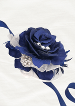 Artificial wedding wrist corsage with a navy blue faux rose, silver beads, a rhinestone accent and navy and sheer white ribbons. For formals, proms and ball occasions. Made in Melbourne by Flowers For Ever After, shipping Australia and Worldwide.