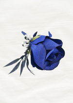 Artificial wedding boutonniere, top view of a navy blue faux rose, silver beads and dark slender foliage. For formals, proms and ball occasions. Made in Melbourne by Flowers For Ever After, shipping Australia and Worldwide.
