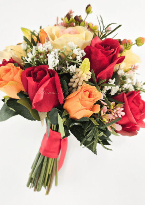 Artificial wedding bouquet, reverse side view of red, orange and peach-cream faux roses, tiny white flowers and red-wrapped stems. Made in Melbourne by Flowers For Ever After, shipping Australia and Worldwide.