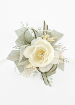 Artificial wedding wrist corsage, overhead view of an ivory faux rose, cream flowers, pale sprigs, olive ribbons and pearl-style bracelet. For formals, proms and ball occasions. Made in Melbourne by Flowers For Ever After, shipping Australia and Worldwide.