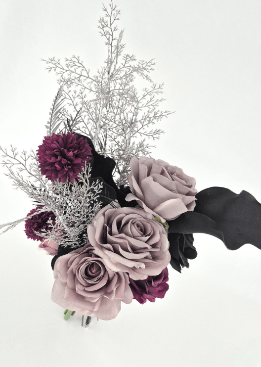 Artificial wedding bridesmaid bouquet, angled view of dusty lilac faux roses, burgundy pompom flowers, black calla lily and silver foliage. Made in Melbourne by Flowers For Ever After, shipping Australia and Worldwide.