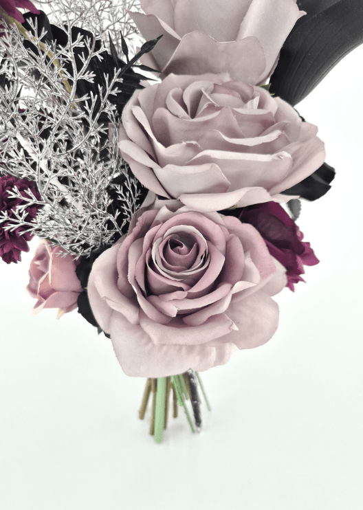 Artificial wedding bouquet detail showing layered dusty lilac faux rose petals, black calla lily and fine silver foliage. Made in Melbourne by Flowers For Ever After, shipping Australia and Worldwide.