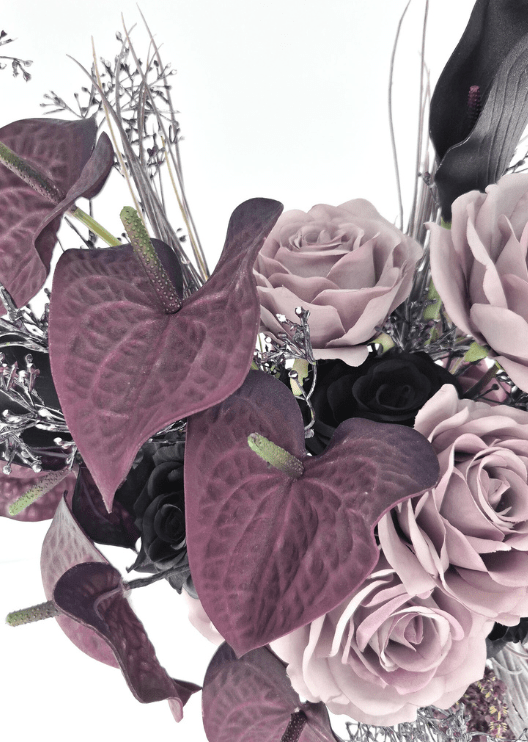 Artificial wedding bouquet close-up with mauve faux anthuriums, dusty lilac roses, black roses and fine silver sprigs. Made in Melbourne by Flowers For Ever After, shipping Australia and Worldwide.