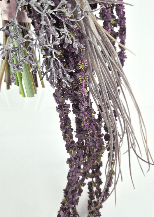 Artificial wedding cascading bouquet detail showing trailing dark purple faux floral strands, long silver grass-like leaves and gathered green stems. Made in Melbourne by Flowers For Ever After, shipping Australia and Worldwide.
