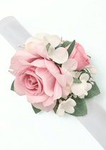 Artificial wedding wrist corsage with pink faux roses, pale filler flowers and ivory ribbon ties. For formals, proms and ball occasions. Made in Melbourne by Flowers For Ever After, shipping Australia and Worldwide.