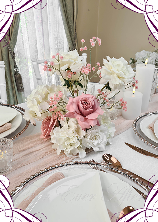 Artificial wedding table flower display with dusty pink and white faux roses, hydrangea, pink baby's breath and matching smaller arrangements. Made in Melbourne by Flowers For Ever After, shipping Australia and Worldwide.