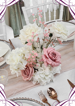 Artificial wedding centrepiece with dusty pink and white faux roses, hydrangea and pink baby's breath, displayed on a clear stand. Made in Melbourne by Flowers For Ever After, shipping Australia and Worldwide.