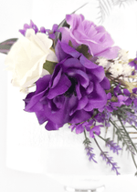Artificial wedding cake flower close-up showing layered purple faux petals, a lilac rose, white rose and tiny white flowers. For birthday, event and celebration cakes. Made in Melbourne by Flowers For Ever After, shipping Australia and Worldwide.
