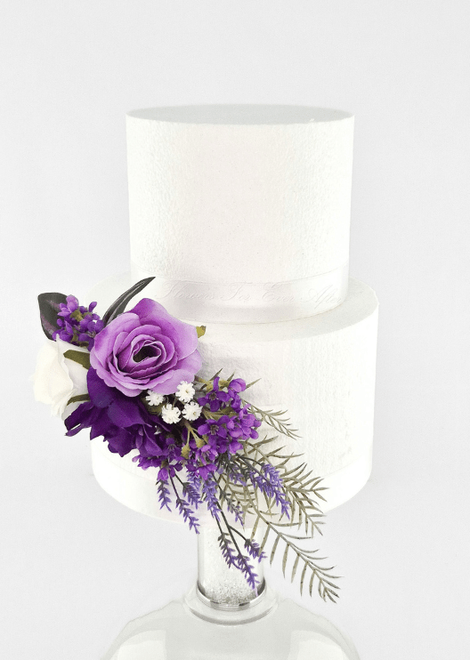Artificial wedding cake decoration, front view of a lilac faux rose, dark purple bloom, white rose and fern-like leaves. For birthday, event and celebration cakes. Made in Melbourne by Flowers For Ever After, shipping Australia and Worldwide.
