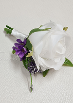 Artificial wedding groom boutonniere with a white faux rose, a smaller pale bloom, green leaves and wrapped stems. For formals, proms and ball occasions. Made in Melbourne by Flowers For Ever After, shipping Australia and Worldwide.