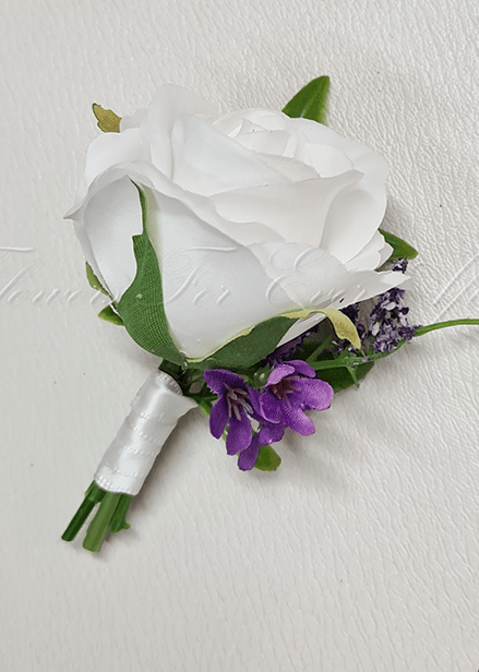 Artificial wedding groom boutonniere, top view of a white faux rose, pale blooms and green foliage. For formals, proms and ball occasions. Made in Melbourne by Flowers For Ever After, shipping Australia and Worldwide.
