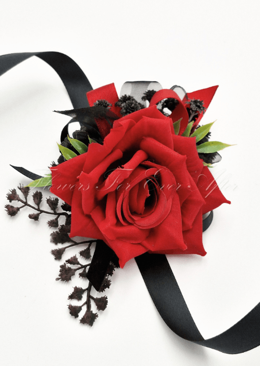 Artificial wedding wrist corsage with red faux roses, black ribbons and silver bead sprays. For formals, proms and ball occasions. Made in Melbourne by Flowers For Ever After, shipping Australia and Worldwide.