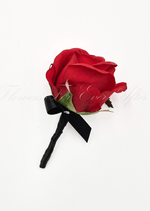 Artificial wedding boutonniere with a red faux rose, black ribbon bow and black-wrapped stem. For formals, proms and ball occasions. Made in Melbourne by Flowers For Ever After, shipping Australia and Worldwide.